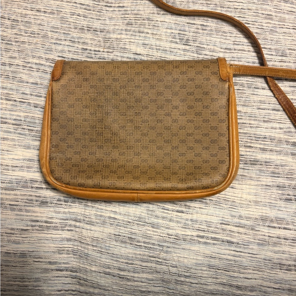 Brown Crossbody Bag with Monogram Pattern and Caramel Trim